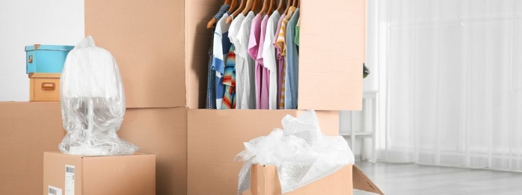 clothes in wardrobe box in storage unit