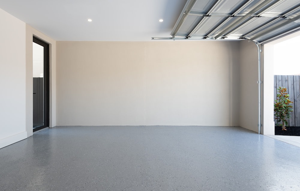 decluttered, empty garage with open door