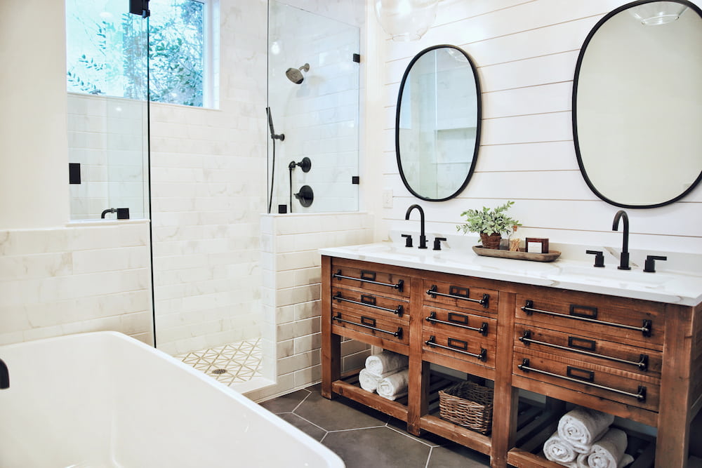 decluttered and organized white bathroom with plenty of storage and clean counters