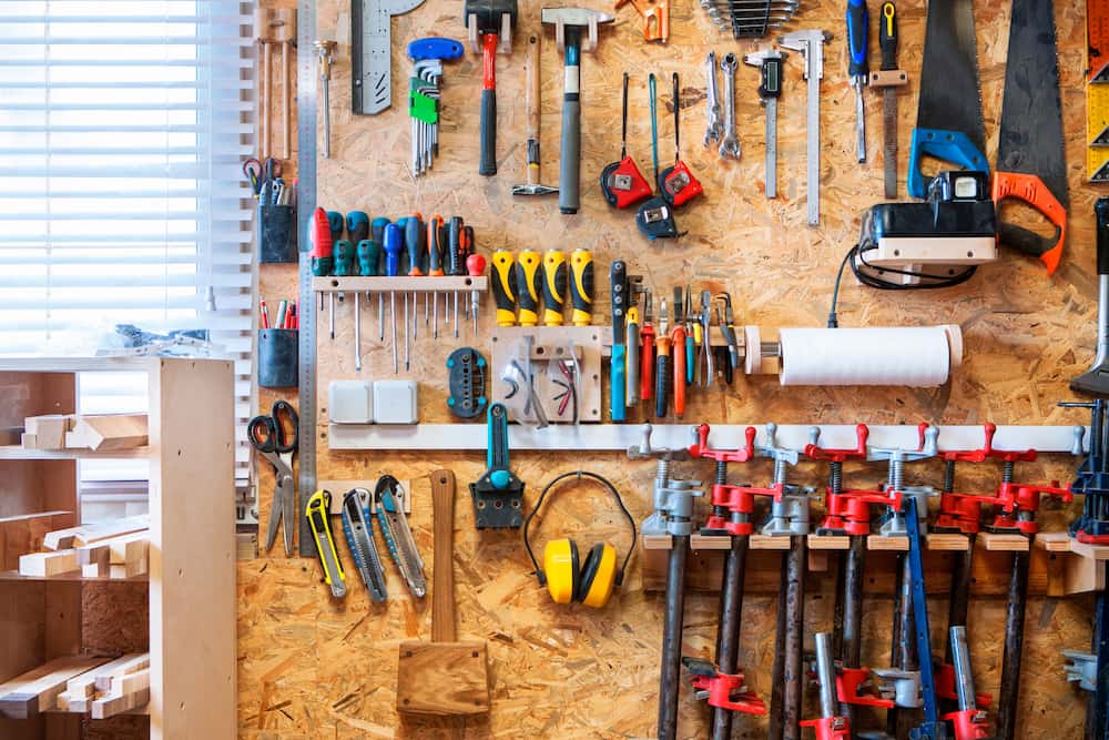 tools hung on the wall of an organized garage